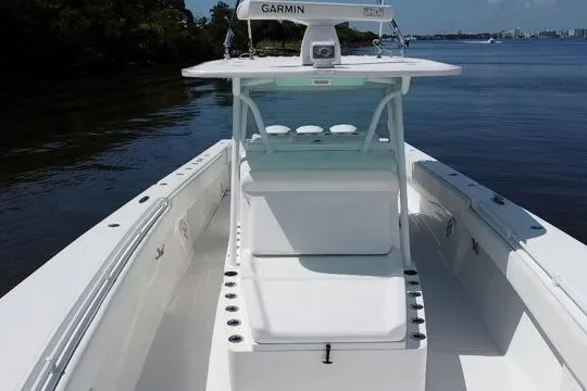 Slide: The Image of 2016 SeaHunter 41 Tournament boat with Garmin equipment on calm water. - 13