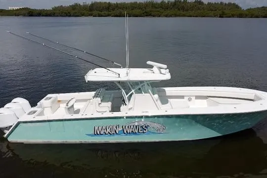 Slide: The Image of 2016 SeaHunter 41 Tournament boat "Makin' Waves" on calm water, side view. - 3