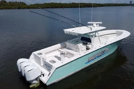 Slide: The Image of 2016 SeaHunter 41 Tournament boat with dual engines on calm water. - 7
