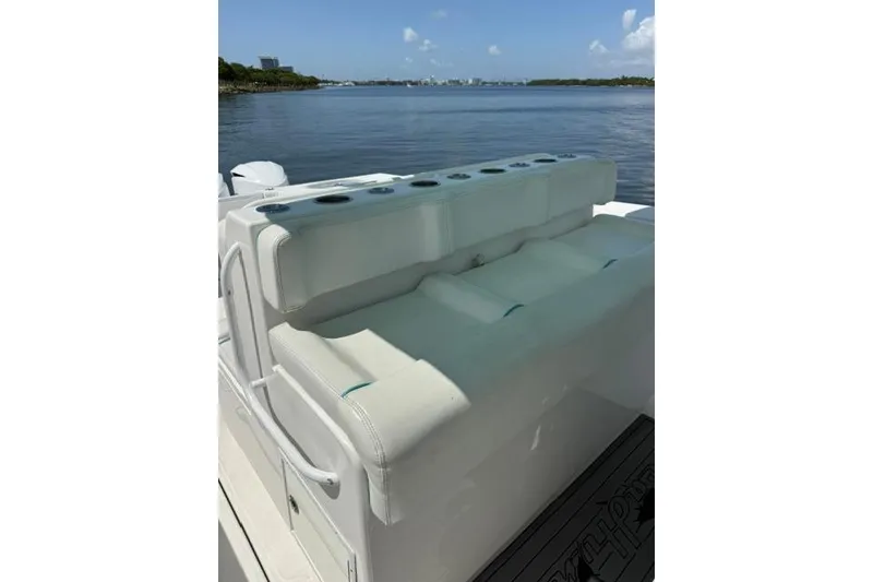 Slide: The Image of 2016 SeaHunter 41 Tournament boat with white seating, overlooking calm waters. - 24