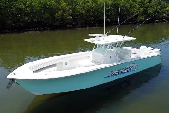 Slide: The Image of 2016 SeaHunter 41 Tournament boat on calm water, featuring sleek design and fishing equipment. - 9