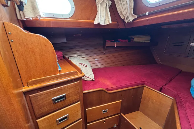 Slide: The Image of Cozy cabin interior of 1974 Hinckley Bermuda 40 MKIII sailboat with wooden furnishings. - 38