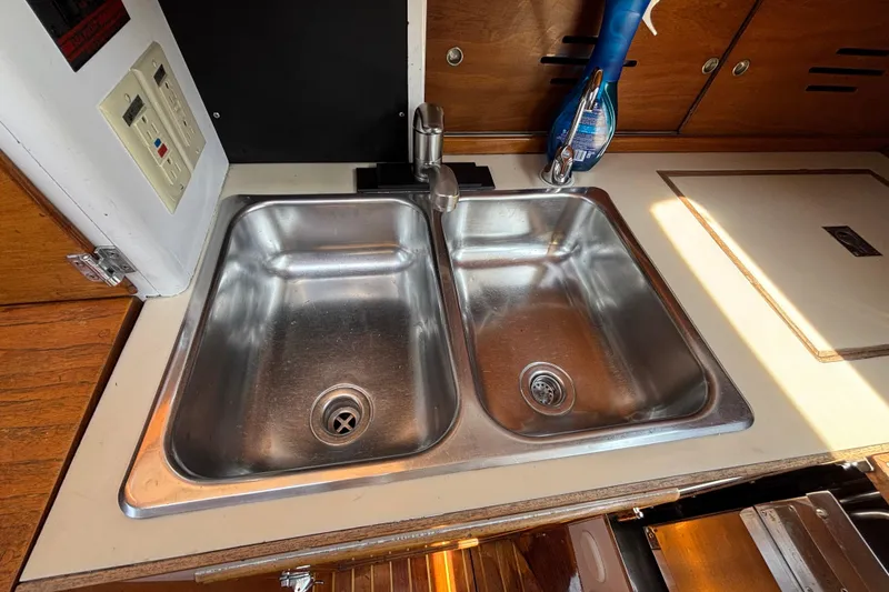 Slide: The Image of Stainless steel double sink in 1974 Hinckley Bermuda 40 MKIII yacht galley. - 32