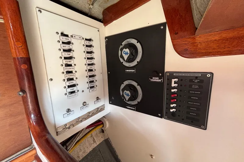Slide: The Image of Electrical panel of a 1974 Hinckley Bermuda 40 MKIII sailboat, featuring switches and controls. - 45