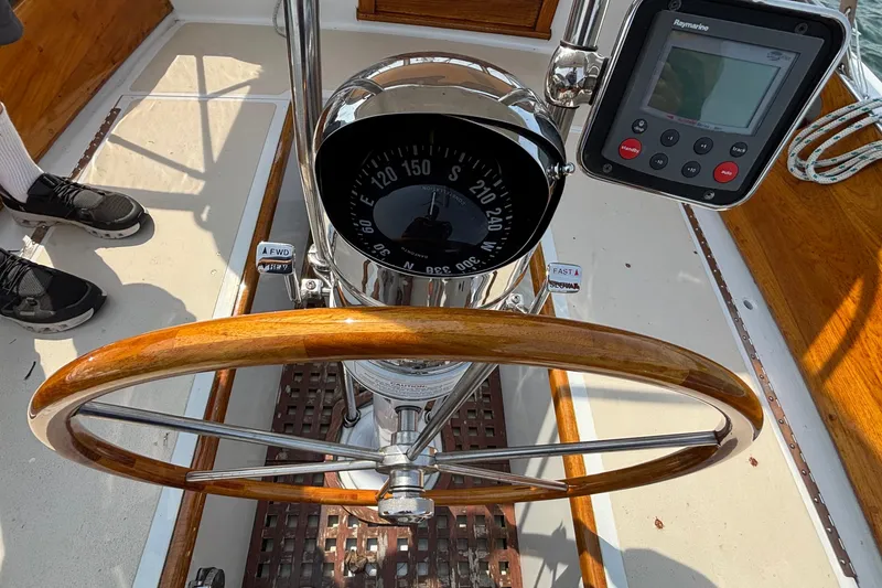 Slide: The Image of Steering wheel and compass of a 1974 Hinckley Bermuda 40 MKIII sailboat cockpit. - 18
