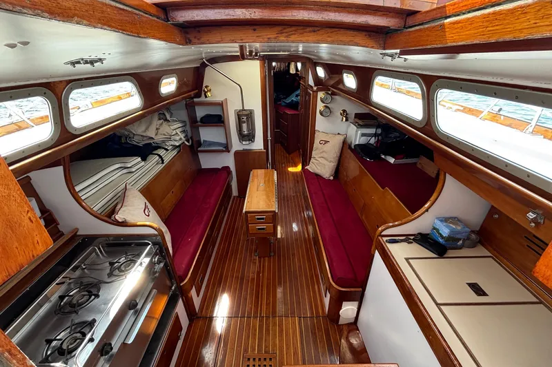 Slide: The Image of Interior of a 1974 Hinckley Bermuda 40 MKIII sailboat with wood finishes and seating. - 24