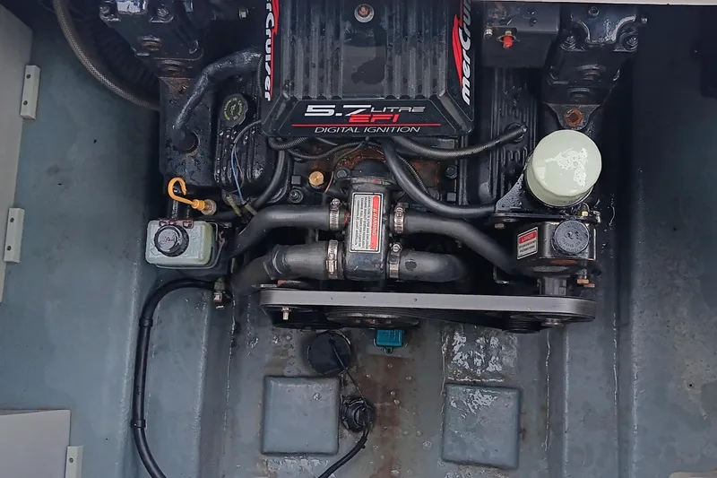 Slide: The Image of Engine compartment of a 1989 Searay 250 Sundancer with MerCruiser 5.7L V8 engine. - 16