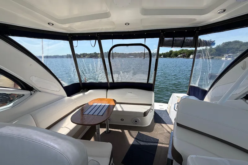 Slide: The Image of Interior of 2009 Cruisers Yachts 360 Express with lake view through windows. - 18