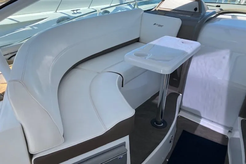 Slide: The Image of 2009 Cruisers Yachts 360 Express interior with white seating and table. - 27