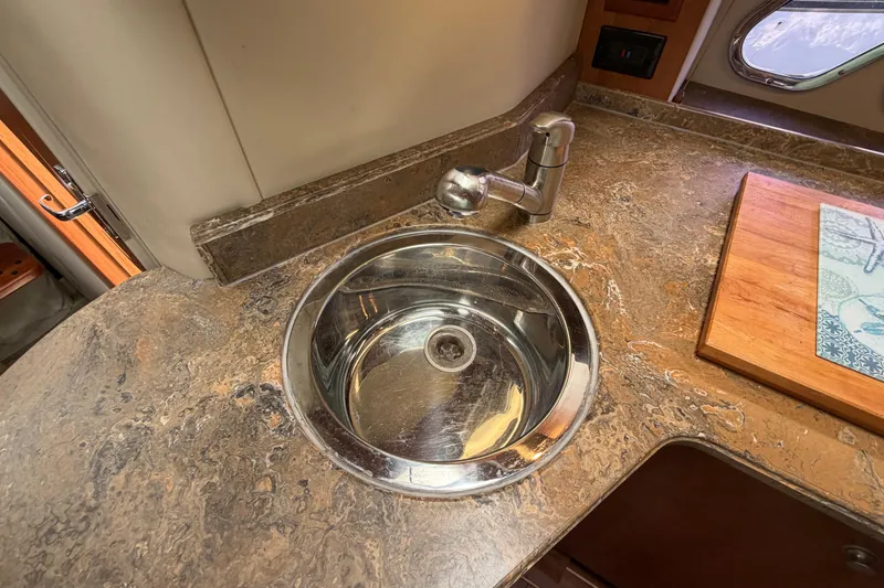 Slide: The Image of 2009 Cruisers Yachts 360 Express kitchen sink with marble countertop and faucet. - 40