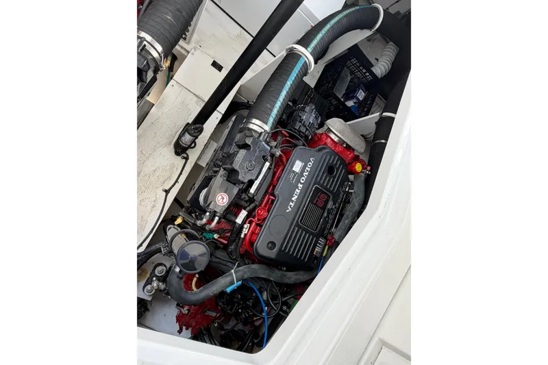 Slide: The Image of Engine compartment of a 2009 Cruisers Yachts 360 Express, featuring a Volvo Penta engine. - 61