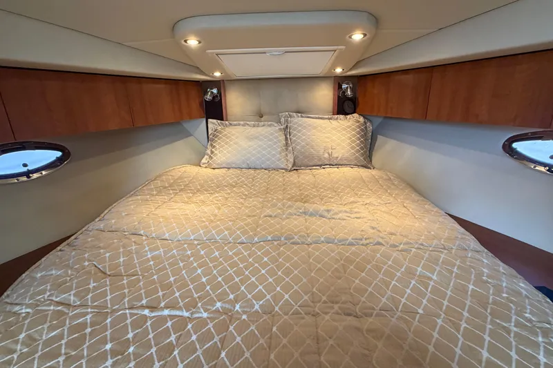 Slide: The Image of Luxurious cabin interior of 2009 Cruisers Yachts 360 Express with cozy bedding. - 45