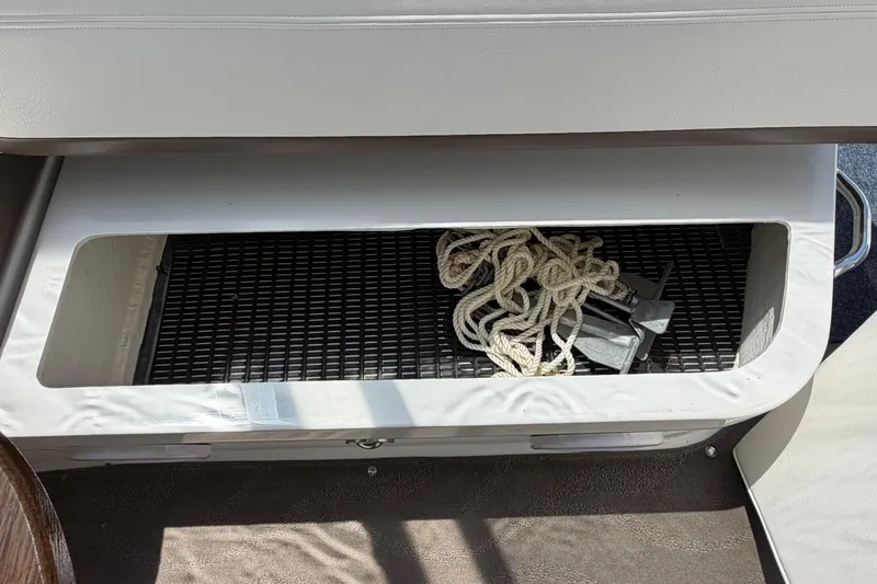 Slide: The Image of Storage compartment on 2009 Cruisers Yachts 360 Express with rope and anchor. - 54
