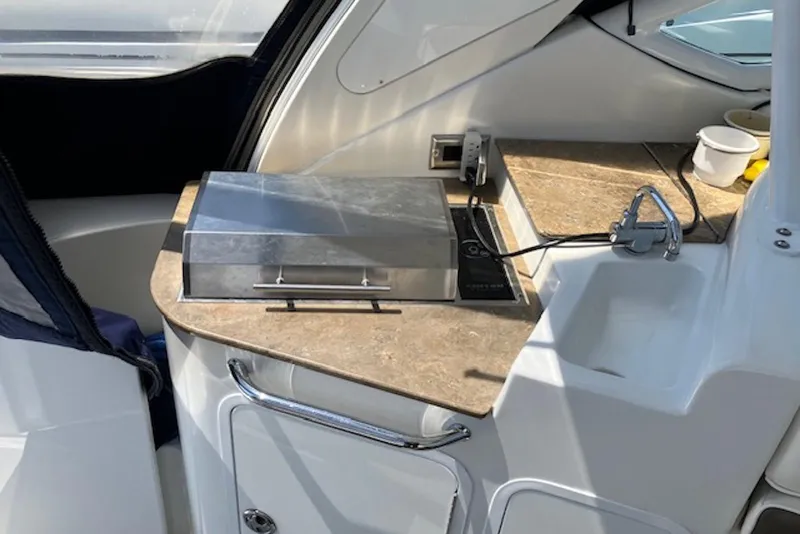 Slide: The Image of 2009 Cruisers Yachts 360 Express interior with kitchenette and sink area. - 16