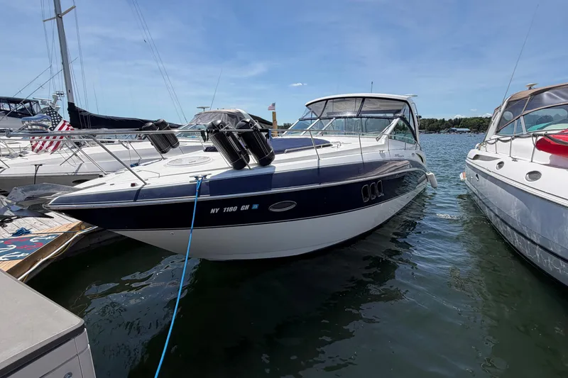 Slide: The Image of 2009 Cruisers Yachts 360 Express docked in a marina on a sunny day. - 9