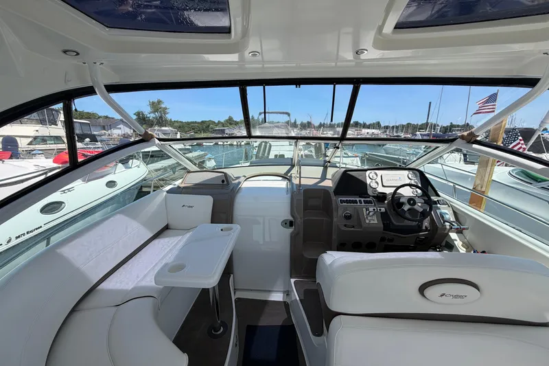 Slide: The Image of Interior view of 2009 Cruisers Yachts 360 Express, featuring helm and seating area. - 26