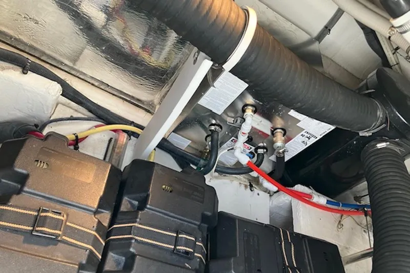Slide: The Image of Engine compartment of 2009 Cruisers Yachts 360 Express, showing battery boxes and wiring. - 52