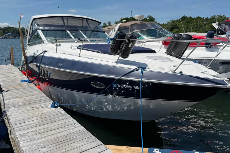 Slide: The Image of 2009 Cruisers Yachts 360 Express docked at a marina on a sunny day. - 5