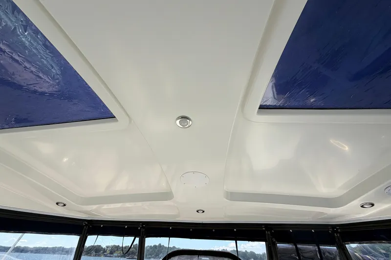 Slide: The Image of Ceiling view of 2009 Cruisers Yachts 360 Express with skylights and recessed lighting. - 22