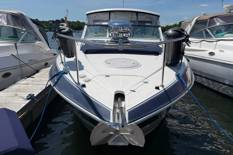 Slide: The Image of 2009 Cruisers Yachts 360 Express docked, front view with anchor and fenders. - 6