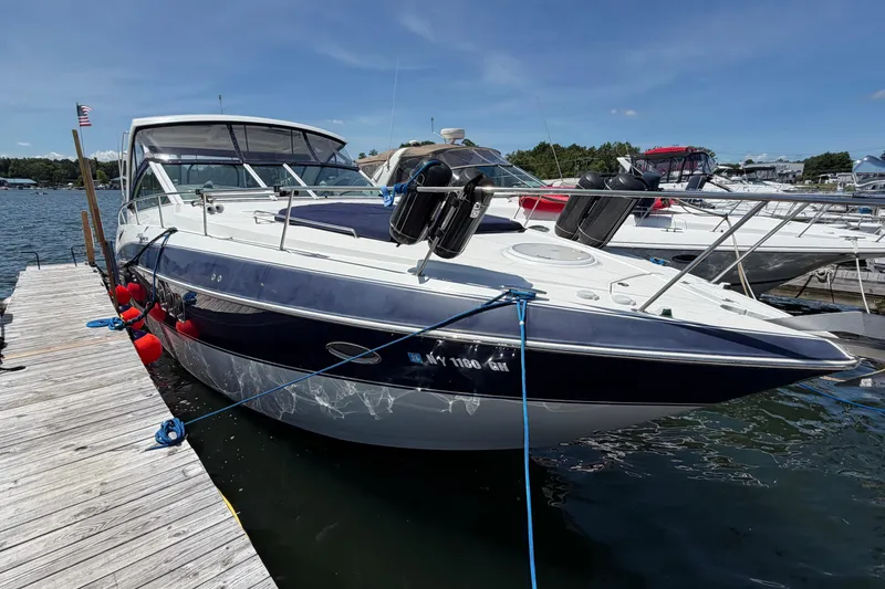 Slide: The Image of 2009 Cruisers Yachts 360 Express docked at marina under clear blue sky. - 10