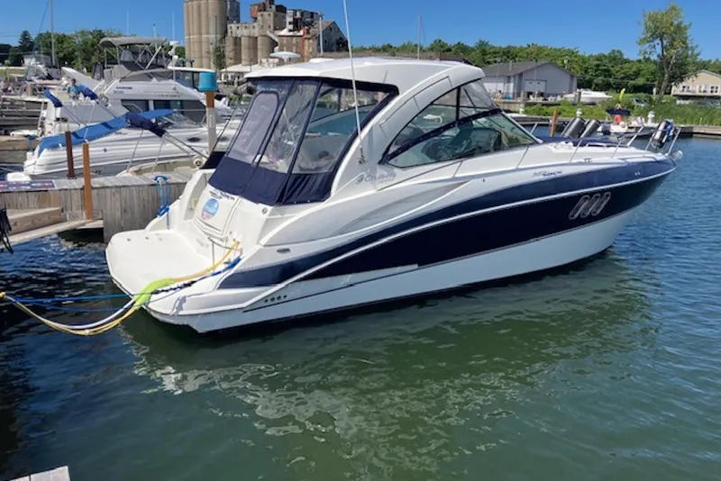The Image of 2009 Cruisers Yachts 360 Express docked at a marina, showcasing sleek design and luxury. - 0