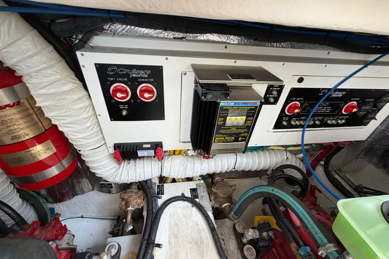 Slide: The Image of Engine room of 2009 Cruisers Yachts 360 Express with control panels and wiring. - 62