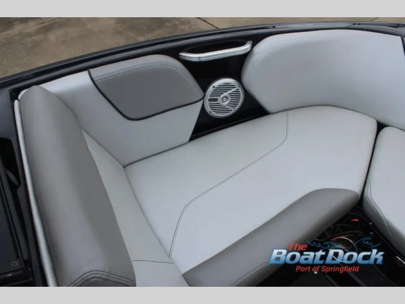 Slide: The Image of The 2017 X Series NXT 22 interior features gray and white upholstery with a speaker. - 33
