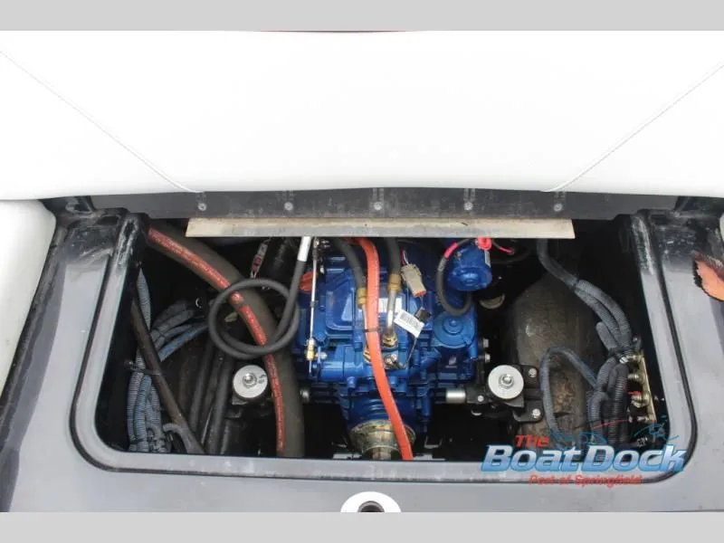 Slide: The Image of The engine compartment of a 2017 X Series NXT 22 boat with visible engine and wiring. - 22