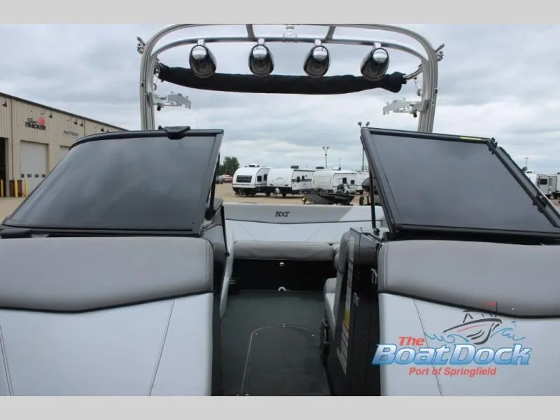 Slide: The Image of The image shows the cockpit of a 2017 X Series NXT 22 boat with gray seating. - 35