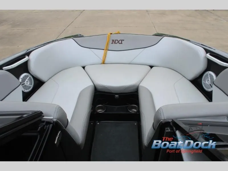 Slide: The Image of The image shows the bow area of a 2017 X Series NXT 22 boat with gray upholstery. - 32