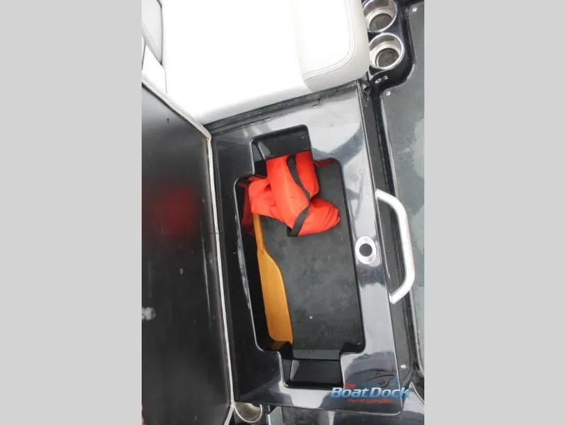 Slide: The Image of An open storage compartment in a boat with an orange life jacket inside. - 20