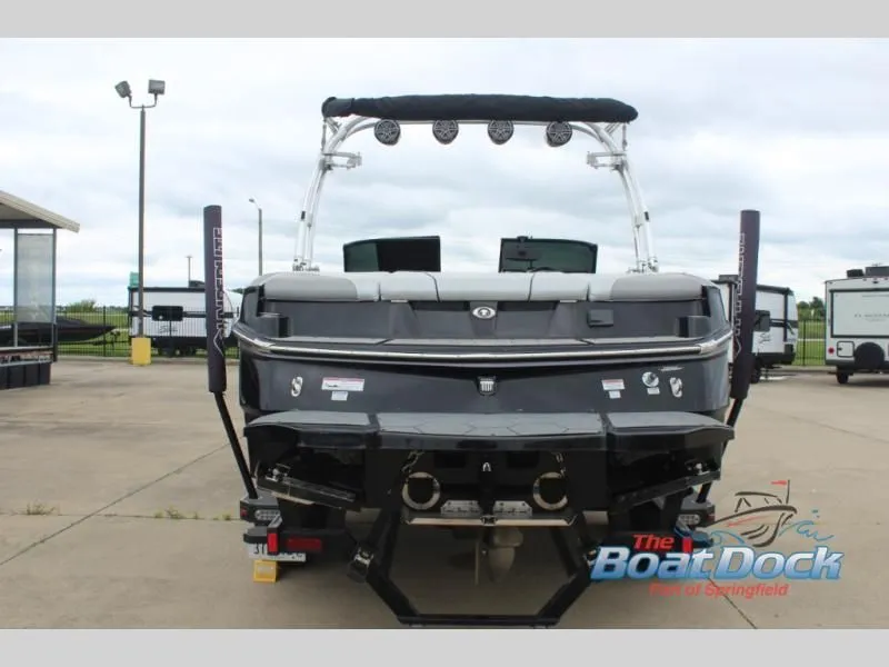 Slide: The Image of Rear view of a black 2017 X Series NXT 22 boat on a trailer. - 7