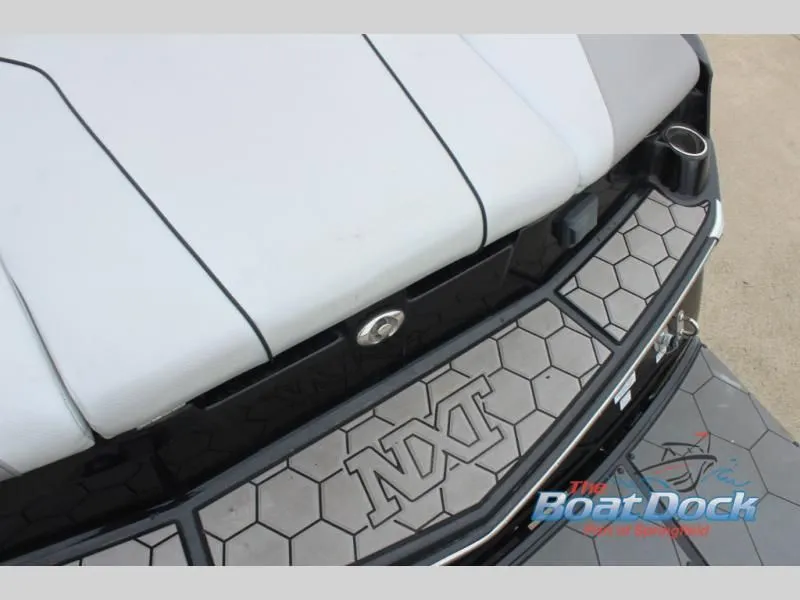 Slide: The Image of Close-up of the stern of a 2017 X Series NXT 22 boat with gray deck and logo. - 13