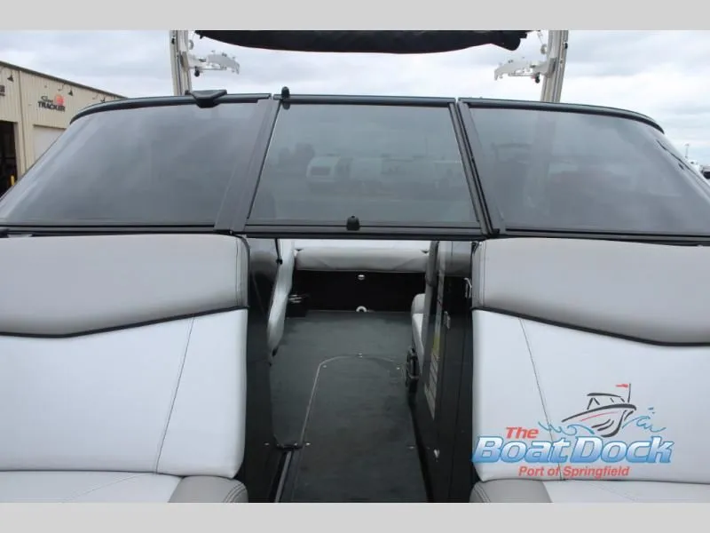 Slide: The Image of The image shows the cockpit of a 2017 X Series NXT 22 boat with gray seating. - 36