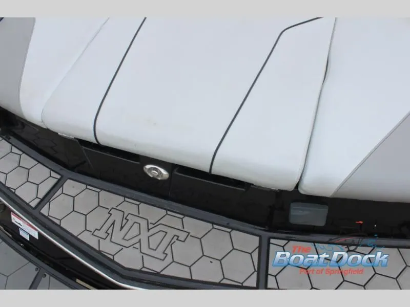 Slide: The Image of Close-up of the stern of a 2017 X Series NXT 22 boat with cushioned seating. - 9