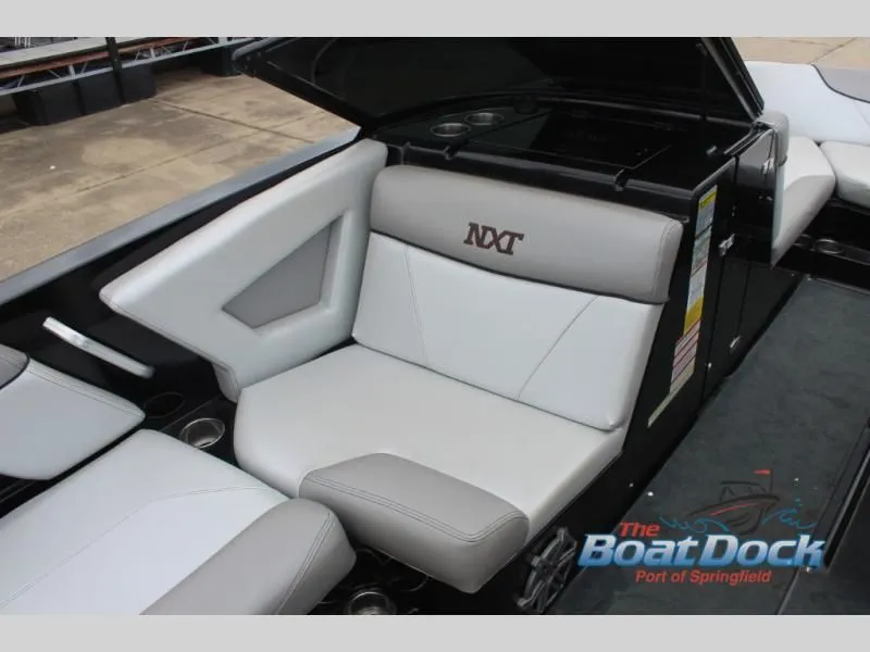Slide: The Image of The image shows the interior of a 2017 X Series NXT 22 boat with gray and white seating. - 15