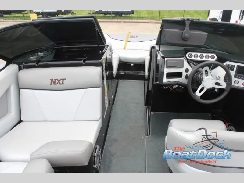 Slide: The Image of Interior view of a 2017 X Series NXT 22 boat with gray and white seating. - 23