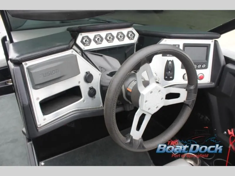 Slide: The Image of The image shows the dashboard of a 2017 X Series NXT 22 boat with modern instruments. - 25