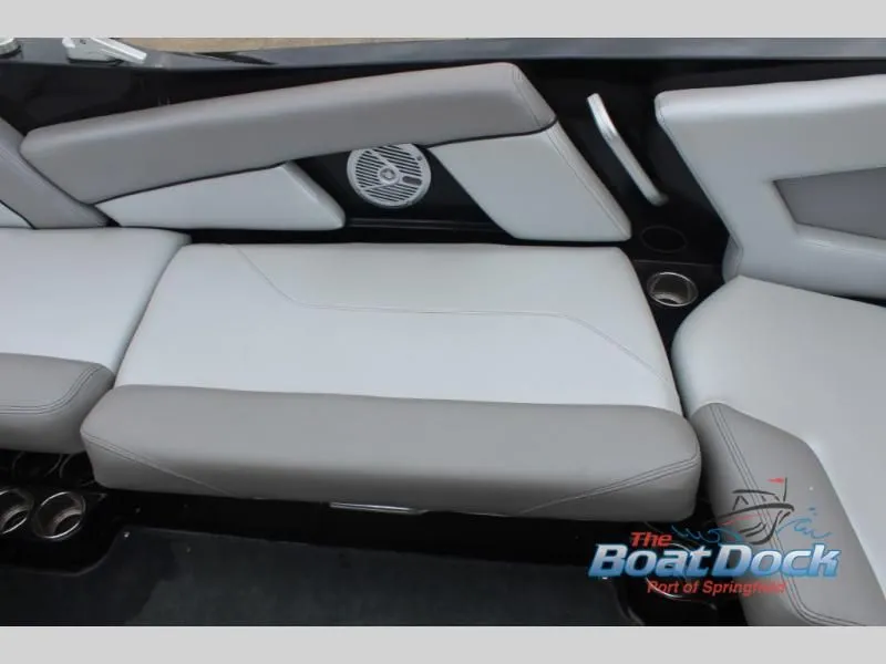 Slide: The Image of The interior of the 2017 X Series NXT 22 features gray upholstery with cup holders. - 16