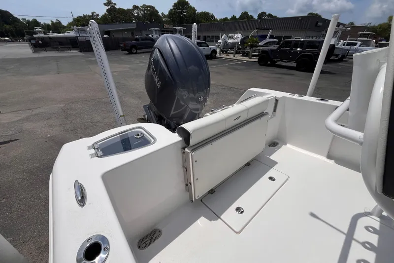 Slide: The Image of 2026 Tidewater 210 CC Adventure boat with Yamaha outboard motor in a parking lot. - 5