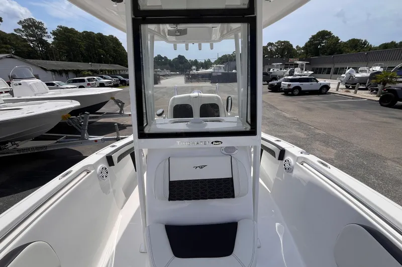 Slide: The Image of 2026 Tidewater 210 CC Adventure boat interior at a dealership. - 11