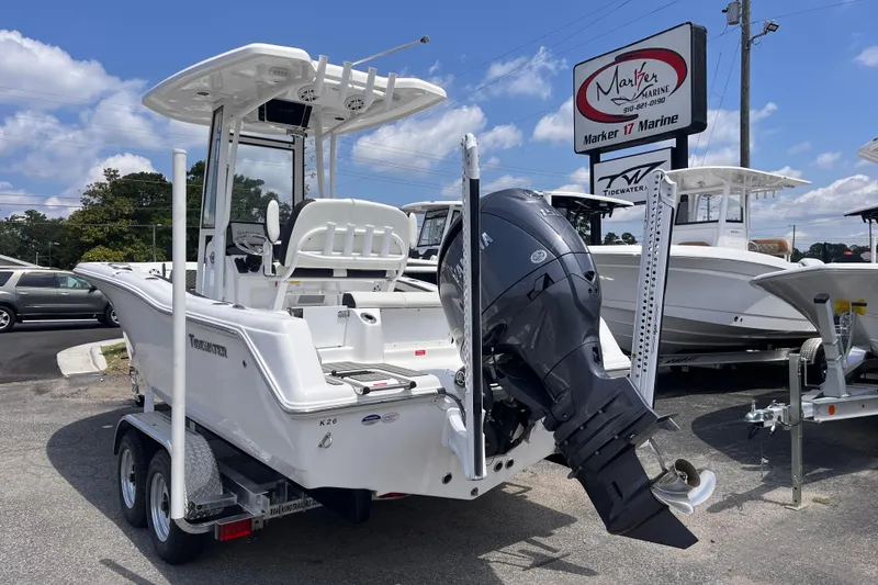 Slide: The Image of 2026 Tidewater 210 CC Adventure boat on trailer at Marker 17 Marine dealership. - 2