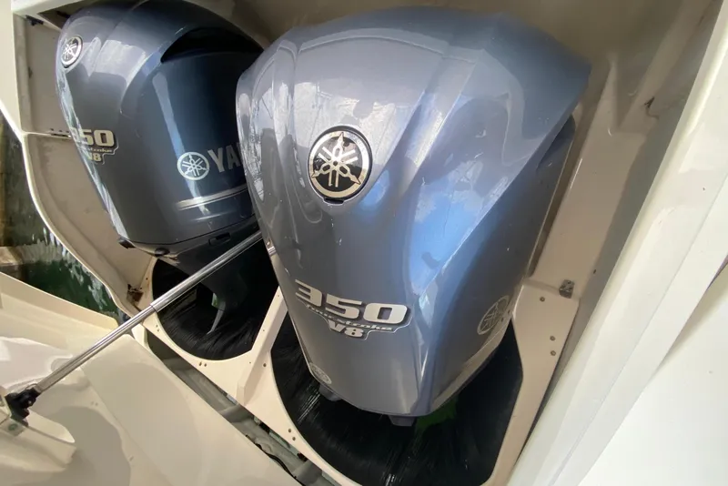 Slide: The Image of 2014 Pursuit SC 365i Sport Coupe with twin Yamaha 350 outboard engines. - 61