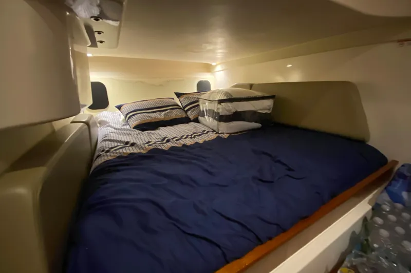Slide: The Image of Cozy cabin interior of 2014 Pursuit SC 365i Sport Coupe with comfortable bedding. - 54