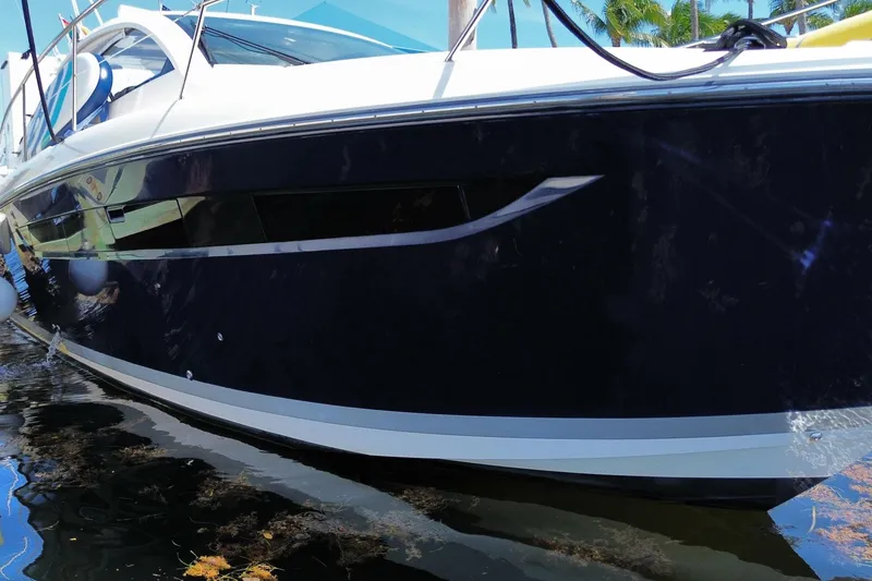 Slide: The Image of 2014 Pursuit SC 365i Sport Coupe docked, showcasing sleek design and modern features. - 69