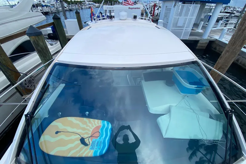 Slide: The Image of 2014 Pursuit SC 365i Sport Coupe docked at marina, view from above. - 21