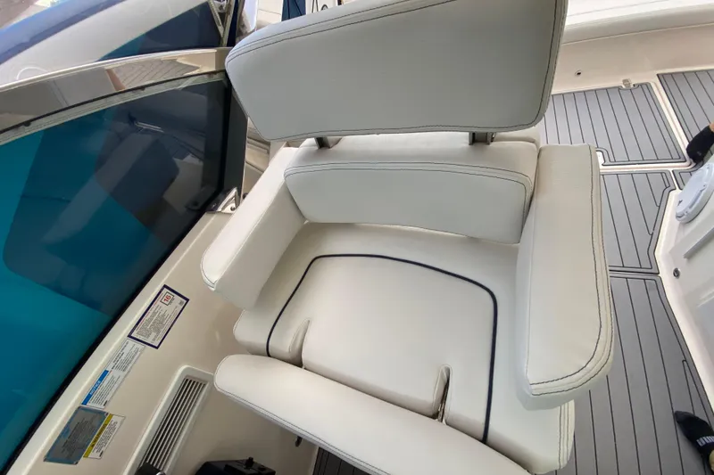Slide: The Image of 2014 Pursuit SC 365i Sport Coupe interior with white leather seating and sleek design. - 32