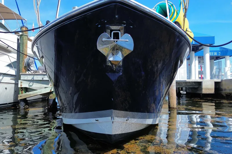 Slide: The Image of Front view of 2014 Pursuit SC 365i Sport Coupe docked at marina. - 1