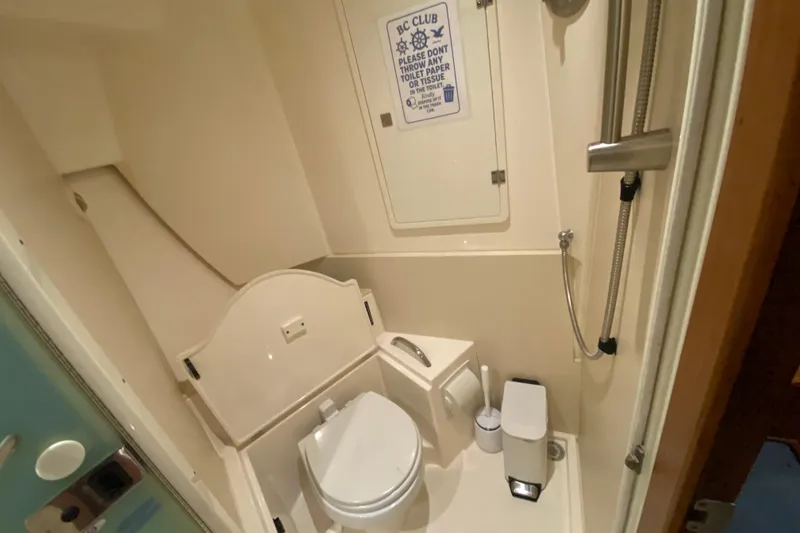 Slide: The Image of Compact bathroom in 2014 Pursuit SC 365i Sport Coupe with shower and toilet. - 56